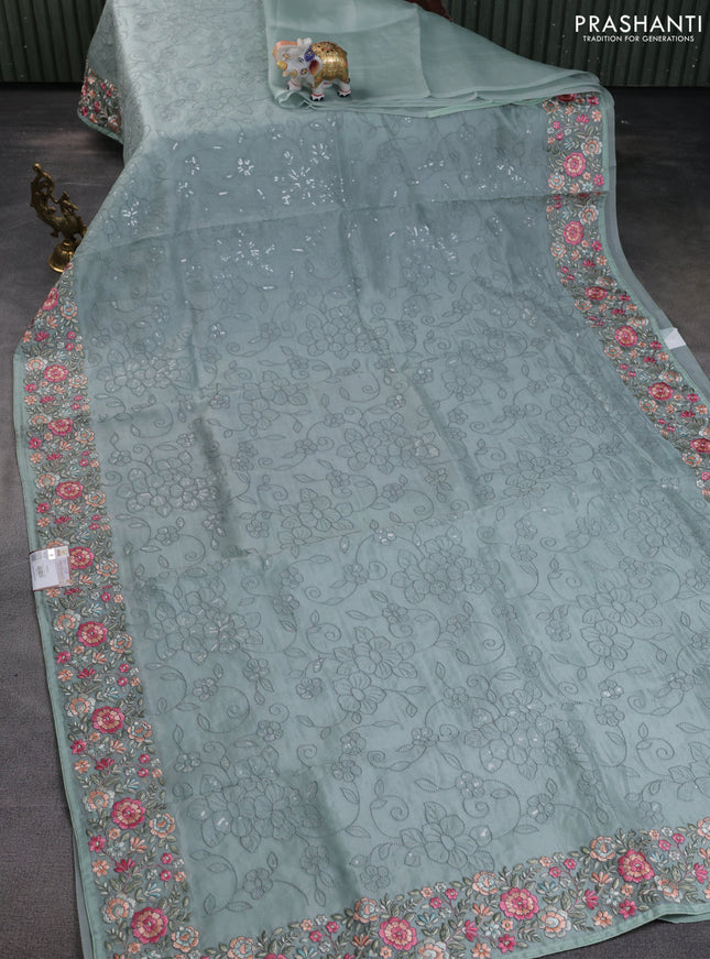 Pure organza silk saree pastel blue shade with allover embroidery and floral embroidery border