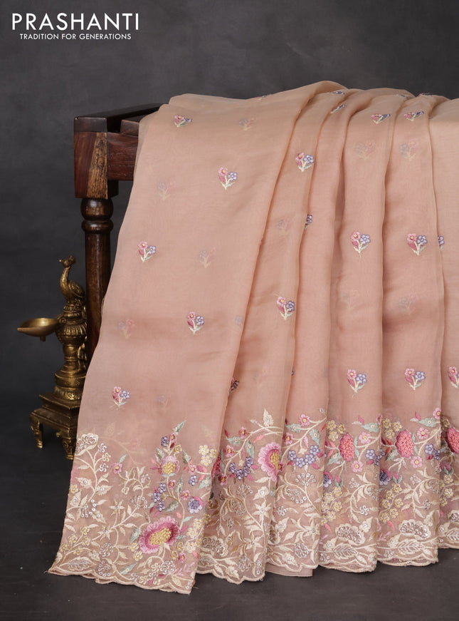 Pure organza silk saree sandal with floral embroidery buttas and floral embroidery border