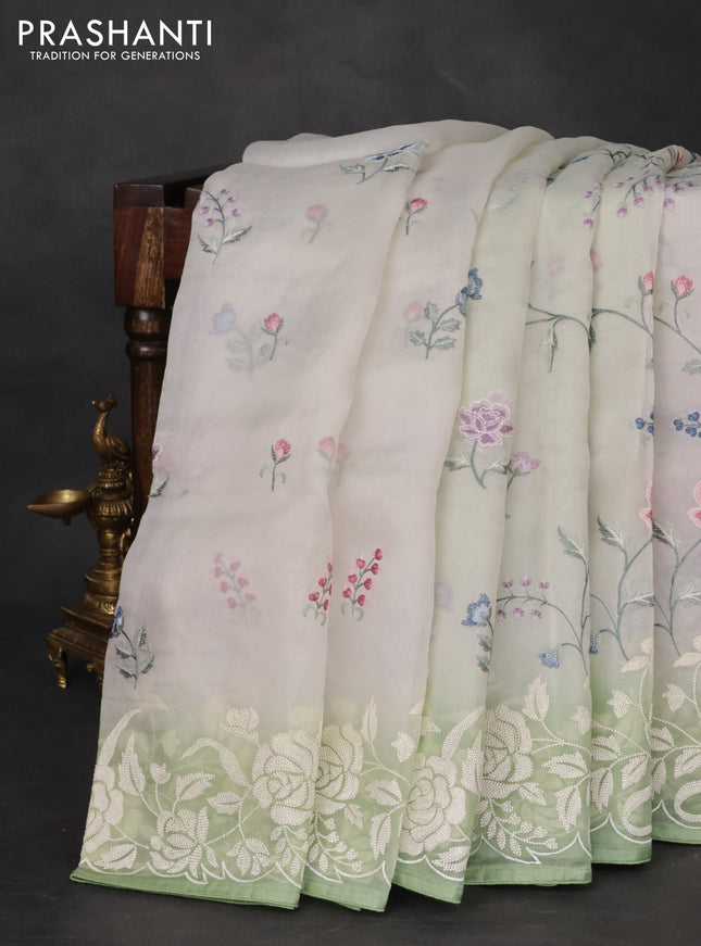 Pure organza silk saree off white and pastel green with allover floral embroidery