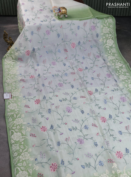 Pure organza silk saree off white and pastel green with allover floral embroidery