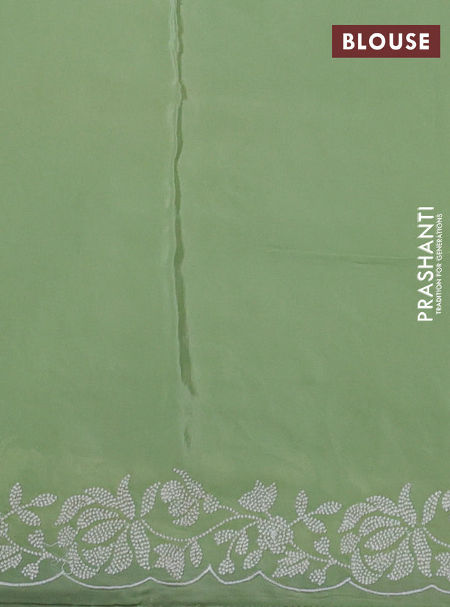 Pure organza silk saree off white and pastel green with allover floral embroidery