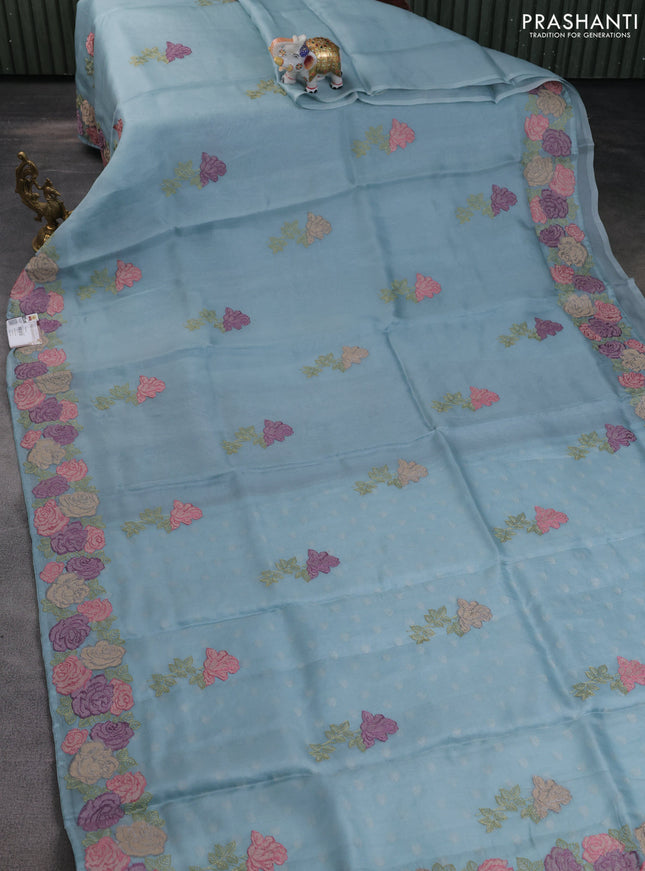 Pure organza silk saree pastel blue with floral embroidery buttas and floral embroidery border
