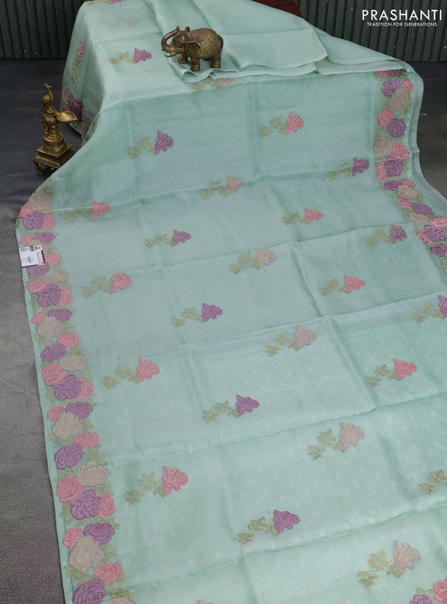 Pure organza silk saree pastel green with floral embroidery buttas and floral embroidery border
