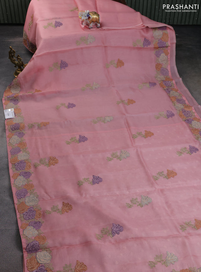 Pure organza silk saree peach shade with floral embroidery buttas and floral embroidery border
