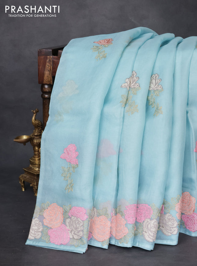 Pure organza silk saree light blue with floral embroidery buttas and floral embroidery border