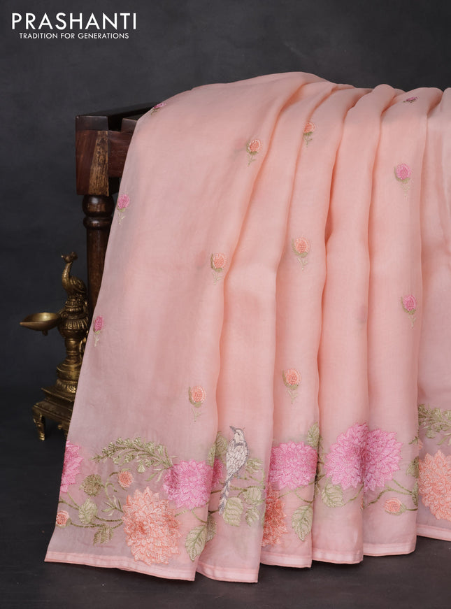 Pure organza silk saree peach orange with floral embroidery buttas and floral embroidery border