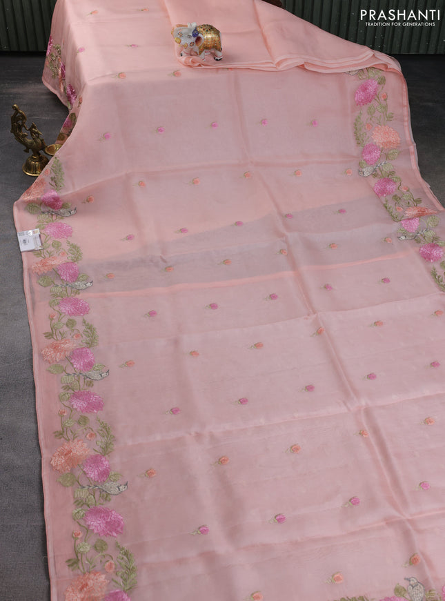 Pure organza silk saree peach orange with floral embroidery buttas and floral embroidery border