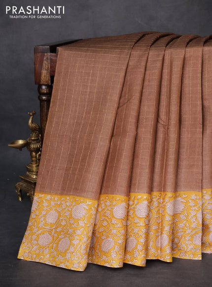 Pure tussar silk saree brown and yellow with allover zari checked pattern and kalamkari printed border