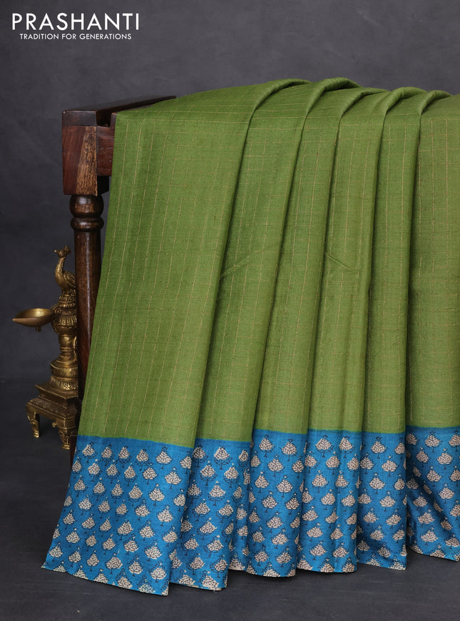 Pure tussar silk saree green and cs blue with allover zari checked pattern and printed border