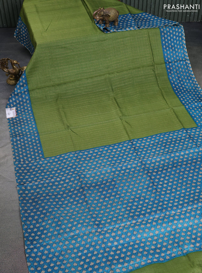 Pure tussar silk saree green and cs blue with allover zari checked pattern and printed border