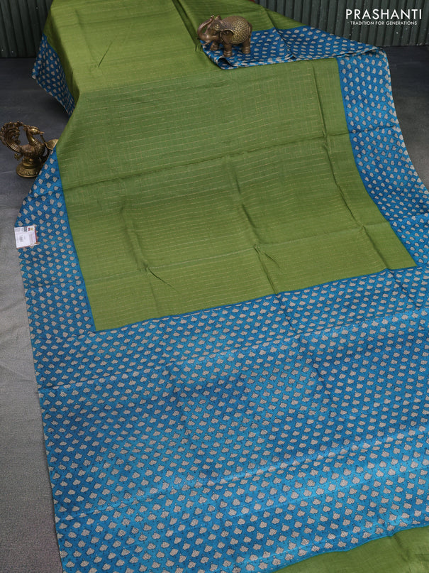 Pure tussar silk saree green and cs blue with allover zari checked pattern and printed border