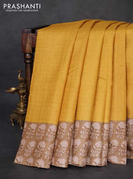 Pure tussar silk saree yellow and beige with allover zari checked pattern and floral printed butta border