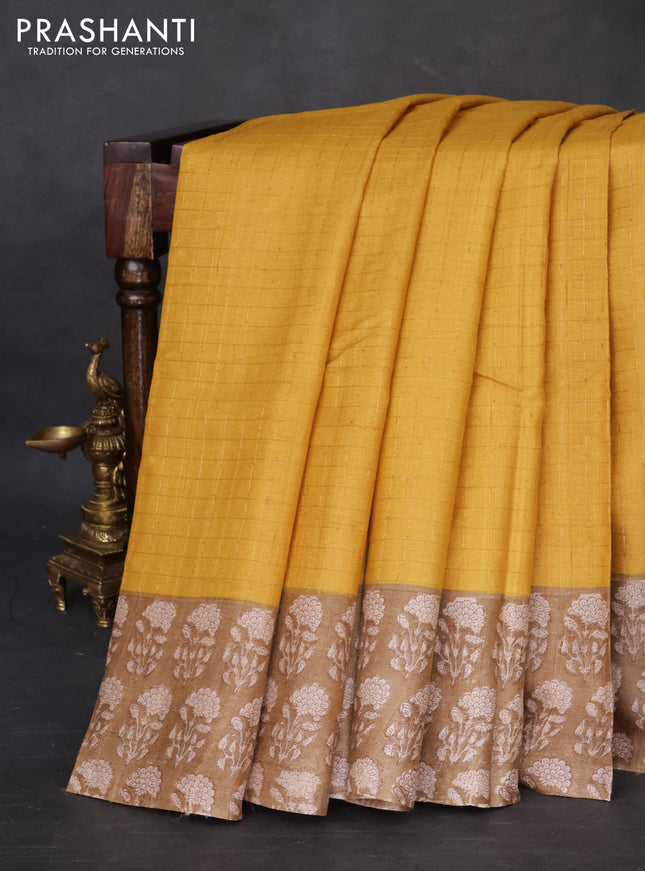 Pure tussar silk saree yellow and beige with allover zari checked pattern and floral printed butta border