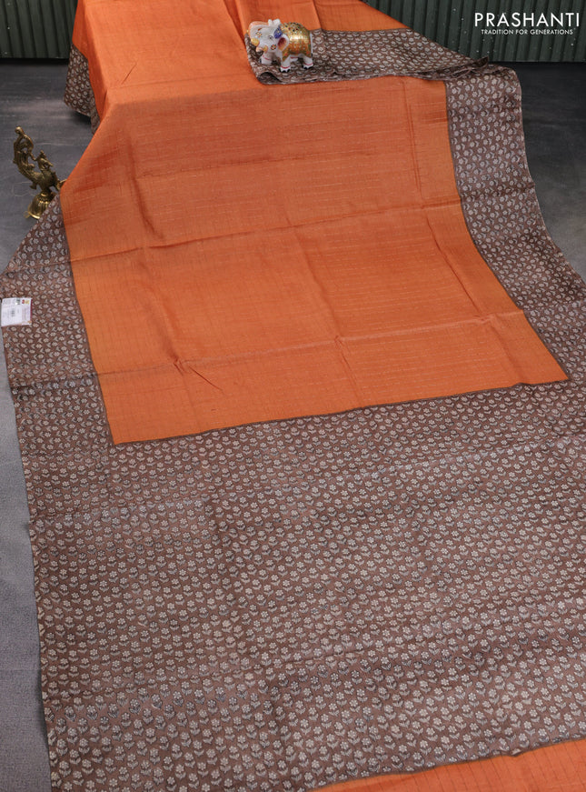 Pure tussar silk saree orange and brown with allover zari checked pattern and floral printed border