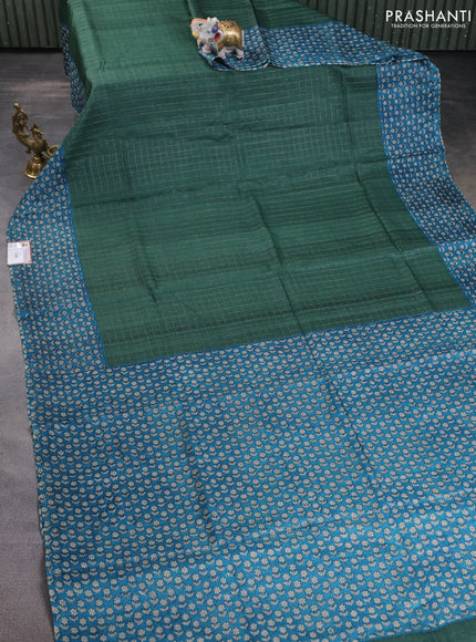 Pure tussar silk saree bottle green and cs blue with allover zari checked pattern and floral printed border