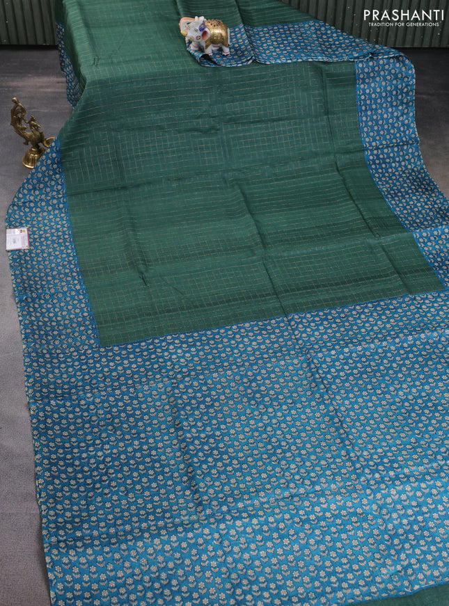 Pure tussar silk saree bottle green and cs blue with allover zari checked pattern and floral printed border