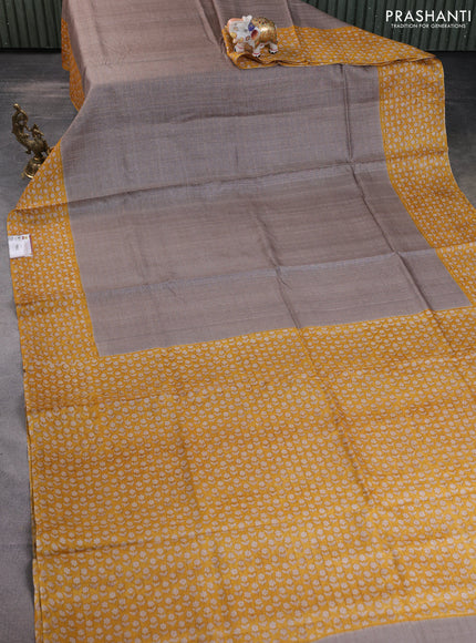 Pure tussar silk saree grey and mustard yellow with allover zari checked pattern and floral printed border