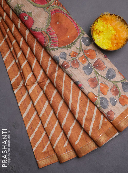Semi tussar saree rust shade and beige with allover leheriya prints & zari buttas and kalamkari prints & pita work pallu