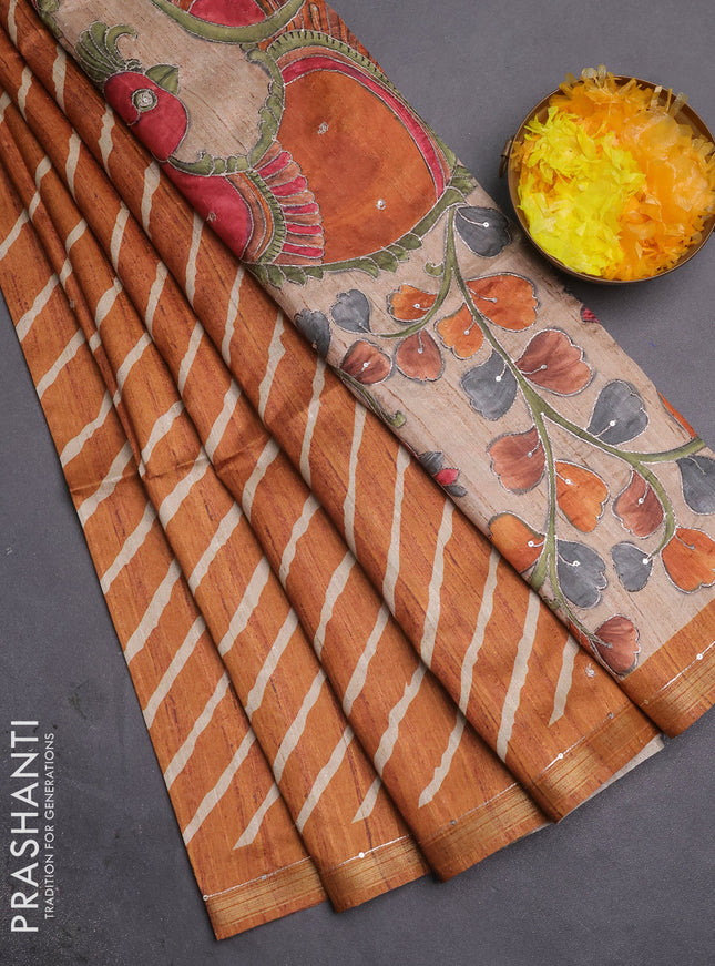 Semi tussar saree rust shade and beige with allover leheriya prints & zari buttas and kalamkari prints & pita work pallu
