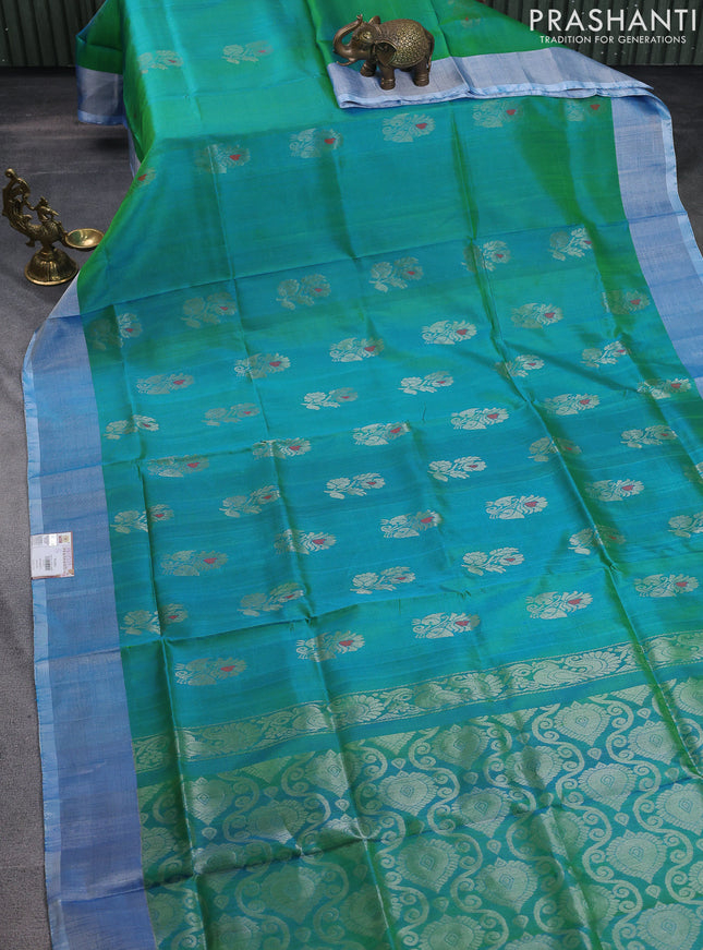 Pure uppada silk saree dual shade of teal blue with silver zari woven floral buttas and silver zari woven border