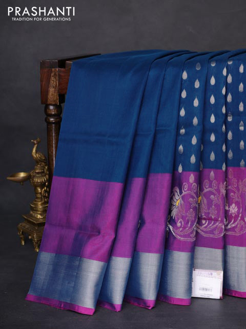Pure uppada silk saree peacock blue and pink with allover silver zari woven thilak buttas and long floral design zari woven border