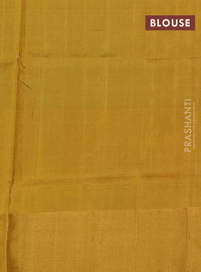 Pure uppada silk saree dark green and yellow with allover zari woven thilak buttas and long floral design zari woven border