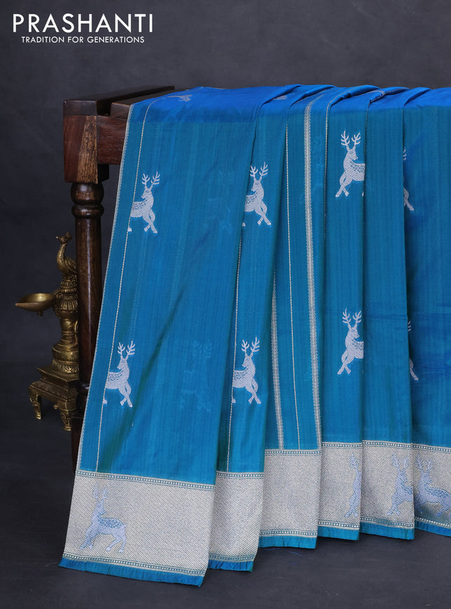 Banarasi semi katan silk saree dual shade of teal bluish green with allover silver & gold zari weaves and deer design zari woven border