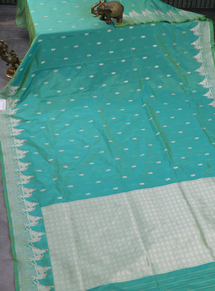 Banarasi semi katan silk saree dual shade of teal bluish green with allover zari woven buttas and parrot design zari woven border