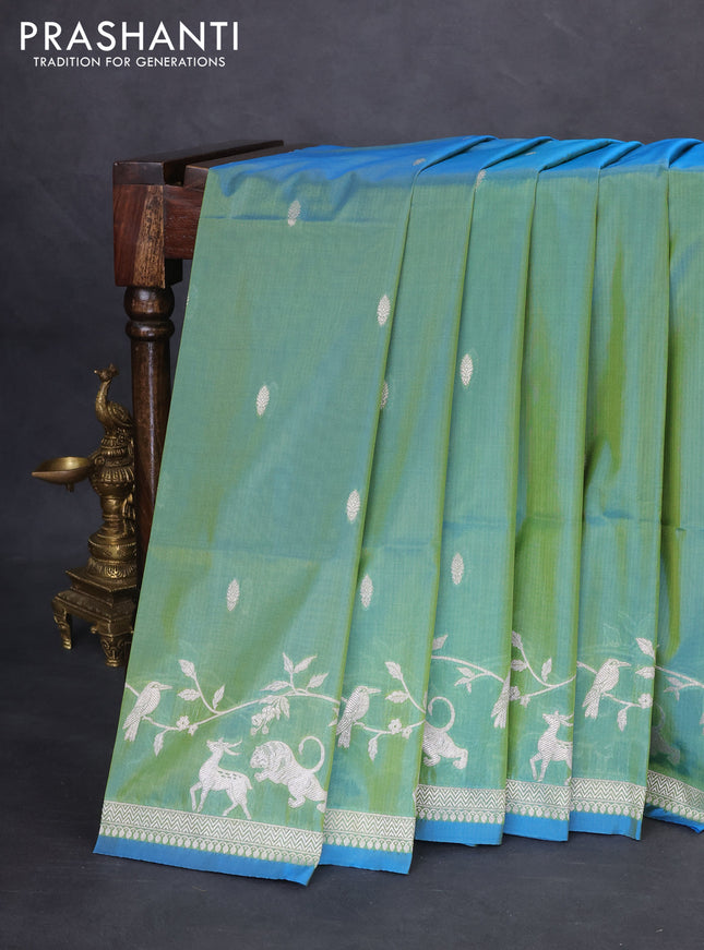 Banarasi semi katan silk saree dual shade of teal bluish green with allover zari woven buttas and rich zari woven border