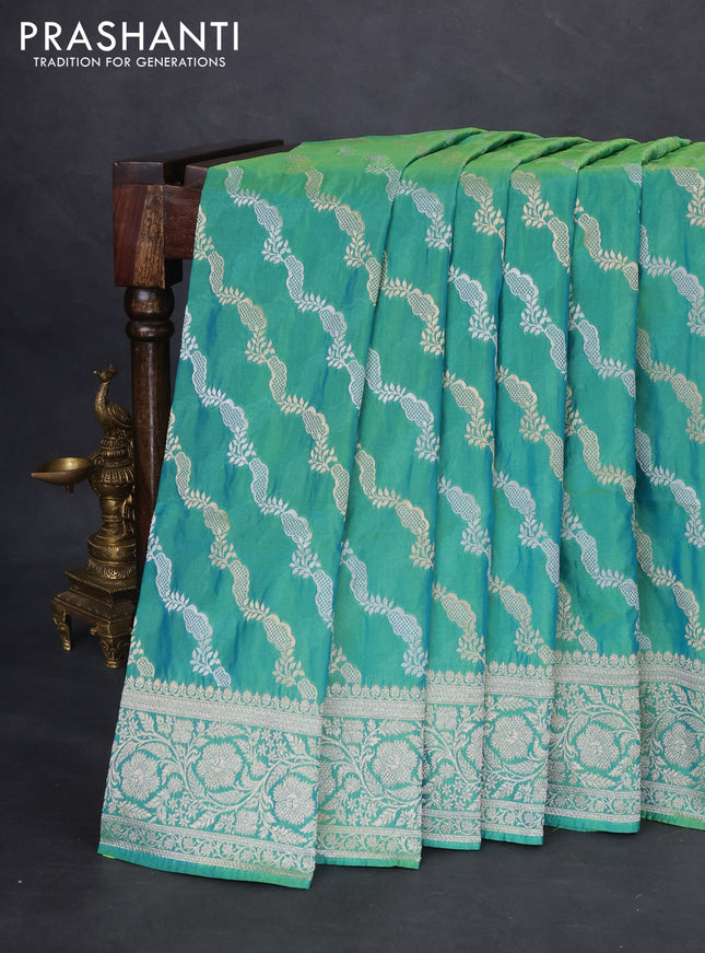 Banarasi semi katan silk saree teal green with allover silver & gold zari weaves and floral zari woven border