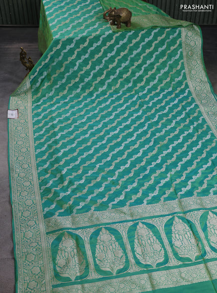 Banarasi semi katan silk saree teal green with allover silver & gold zari weaves and floral zari woven border