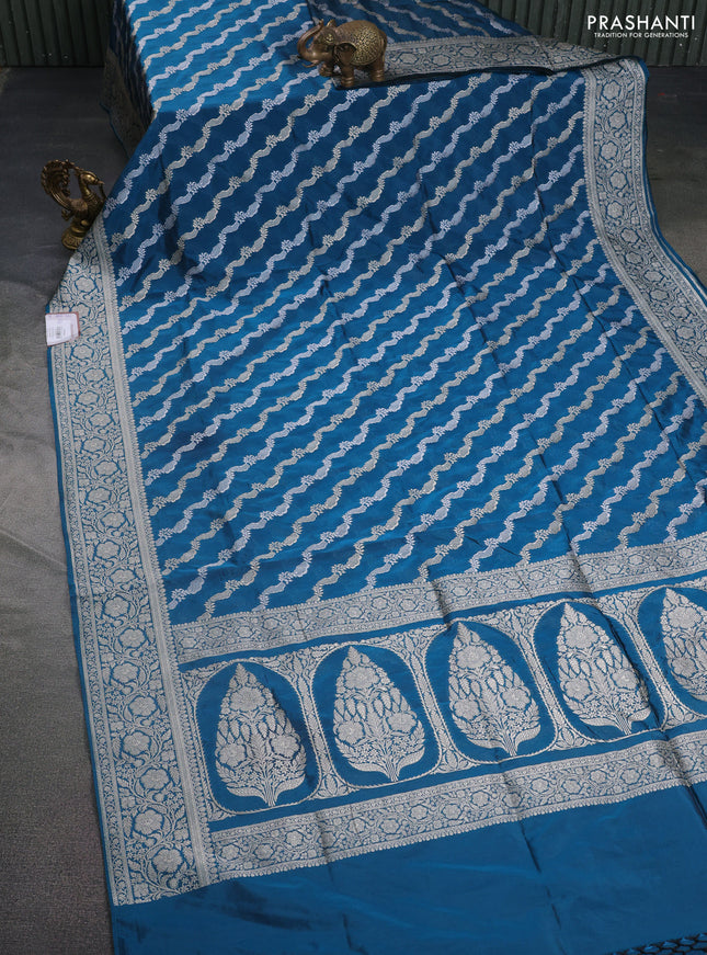 Banarasi semi katan silk saree peacock blue with allover silver & gold zari weaves and floral zari woven border