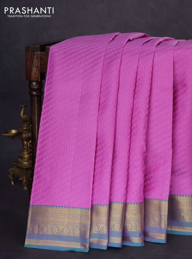 Pure kanchipuram silk saree lavender shade and dual shade of teal blue with allover self emboss & zari buttas and rich zari woven border