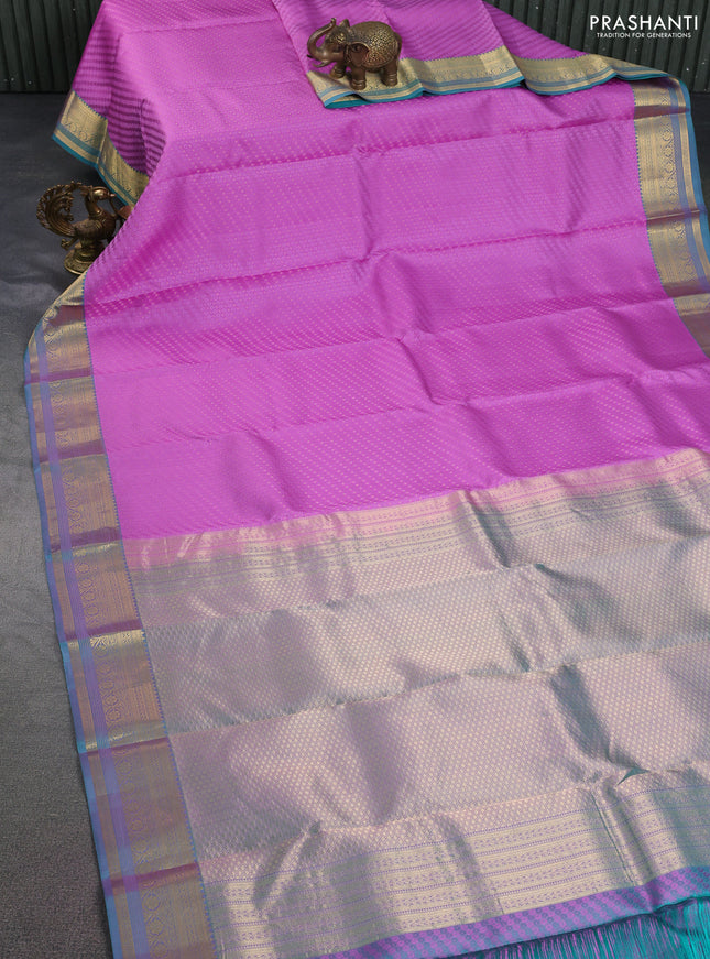 Pure kanchipuram silk saree lavender shade and dual shade of teal blue with allover self emboss & zari buttas and rich zari woven border