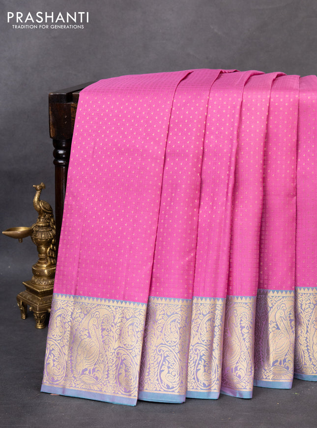 Pure kanchipuram silk saree pink and dual shade of teal blue with allover self emboss & zari buttas and paisley zari woven border