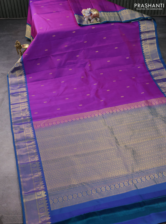 Pure kanchipuram silk saree purple and dual shade of bluish green with zari woven buttas and zari woven border