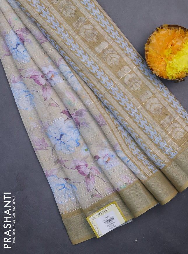 Linen cotton saree sandal and mustard shade with floral prints & sequin work and silver zari woven border