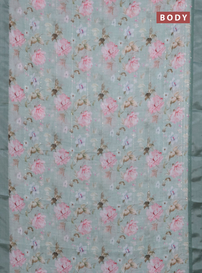 Linen cotton saree pastel green with floral prints & sequin work and silver zari woven border