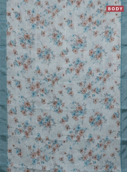 Linen cotton saree teal blue shade with floral prints & sequin work and silver zari woven border