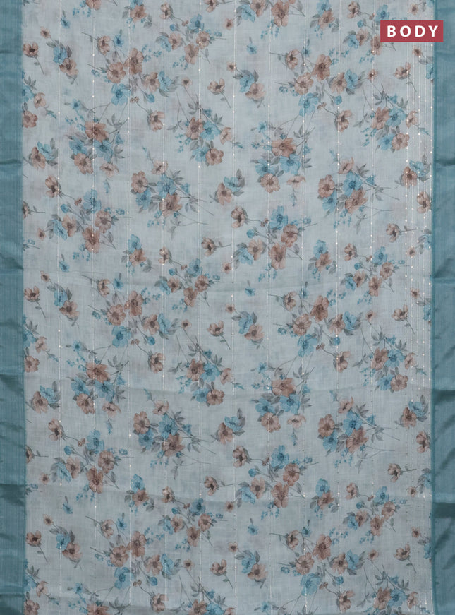 Linen cotton saree teal blue shade with floral prints & sequin work and silver zari woven border