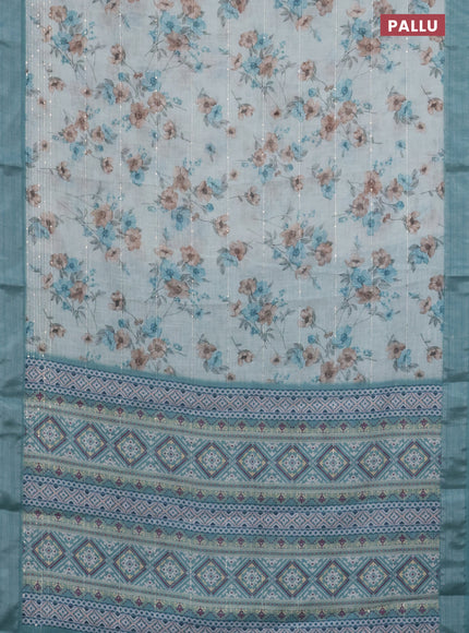 Linen cotton saree teal blue shade with floral prints & sequin work and silver zari woven border