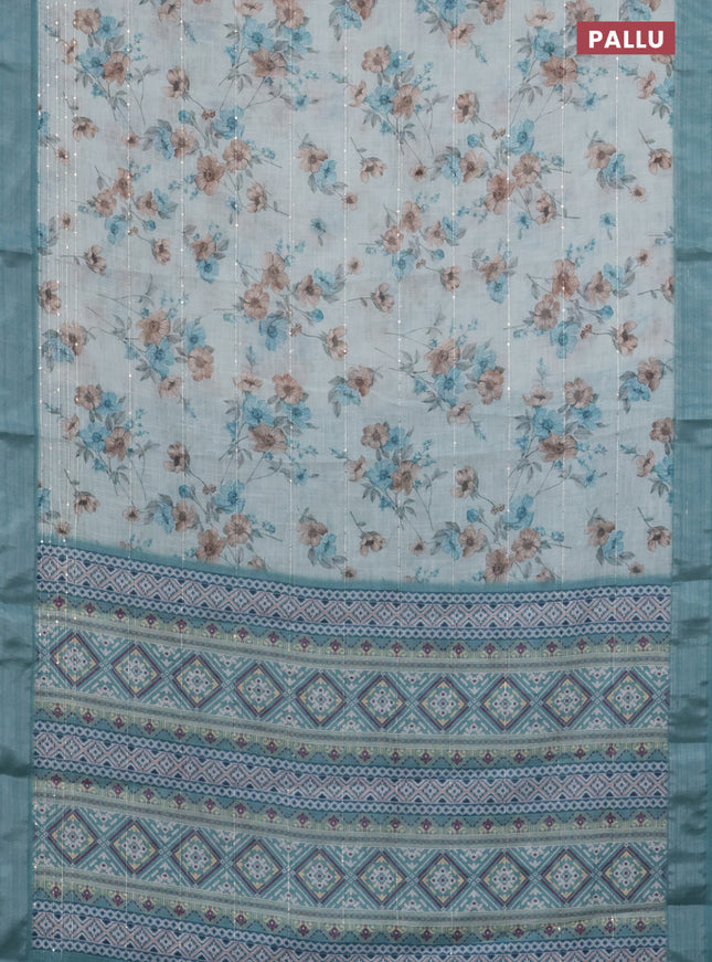 Linen cotton saree teal blue shade with floral prints & sequin work and silver zari woven border