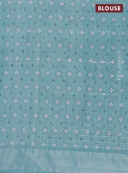 Linen cotton saree teal blue shade with floral prints & sequin work and silver zari woven border