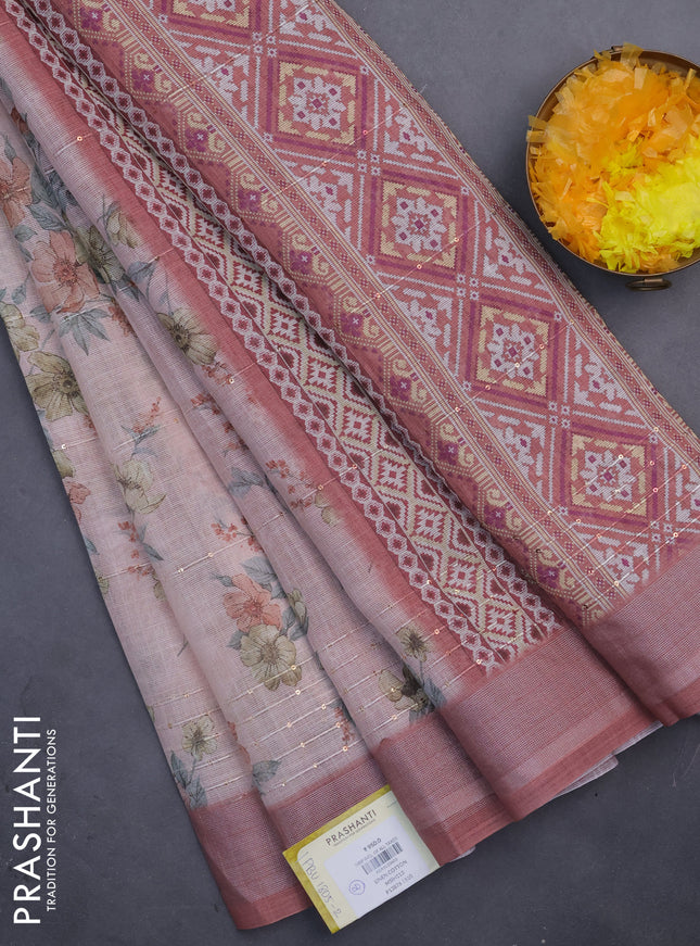Linen cotton saree peach pink and rust shade with floral prints & sequin work and silver zari woven border