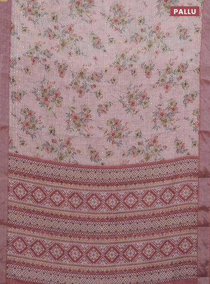 Linen cotton saree peach pink and rust shade with floral prints & sequin work and silver zari woven border