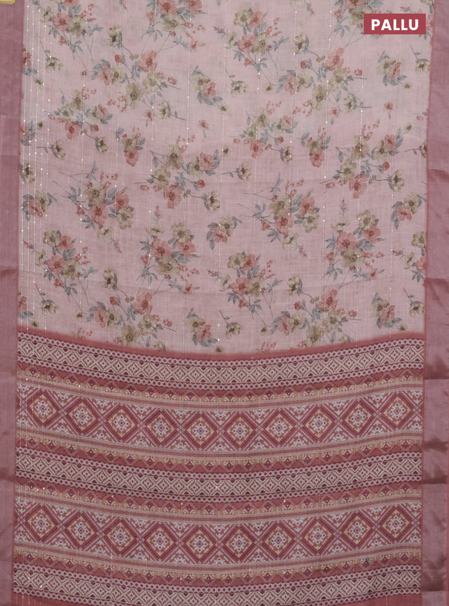 Linen cotton saree peach pink and rust shade with floral prints & sequin work and silver zari woven border