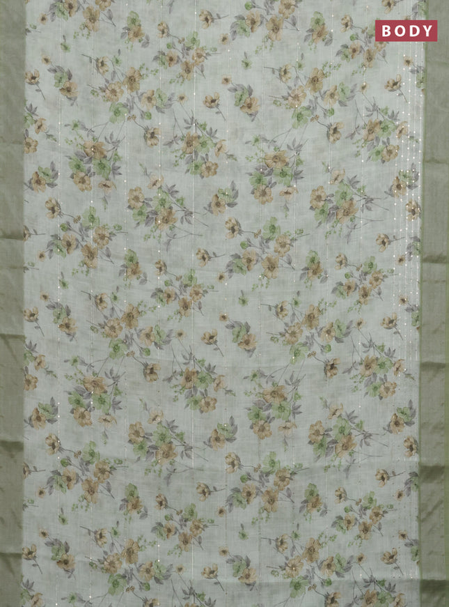 Linen cotton saree pastel green with floral prints & sequin work and silver zari woven border