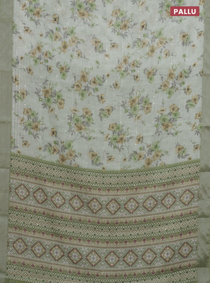 Linen cotton saree pastel green with floral prints & sequin work and silver zari woven border
