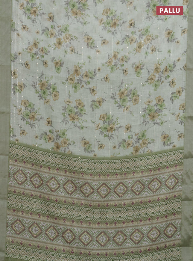 Linen cotton saree pastel green with floral prints & sequin work and silver zari woven border