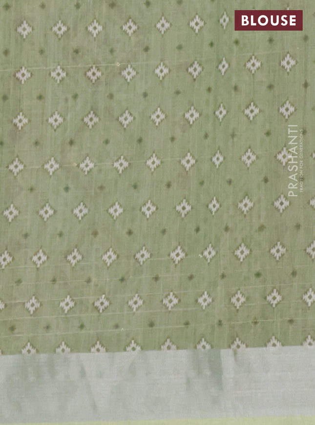 Linen cotton saree pastel green with floral prints & sequin work and silver zari woven border